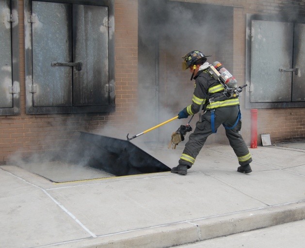 FF/EMT Pires opens up the basement doors at a live burn drill.